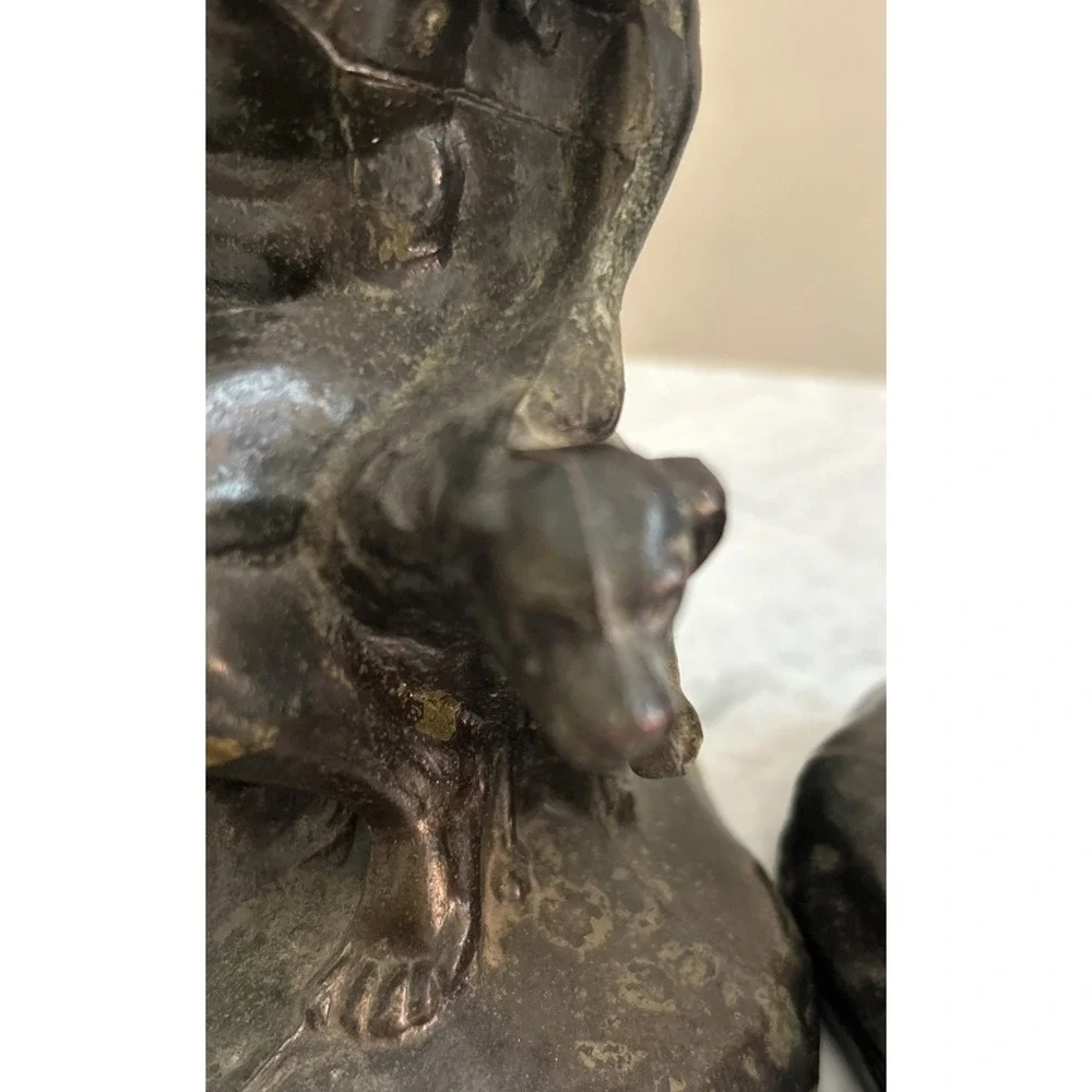 Antique Meal metal cast Indian bookends. Good condition.